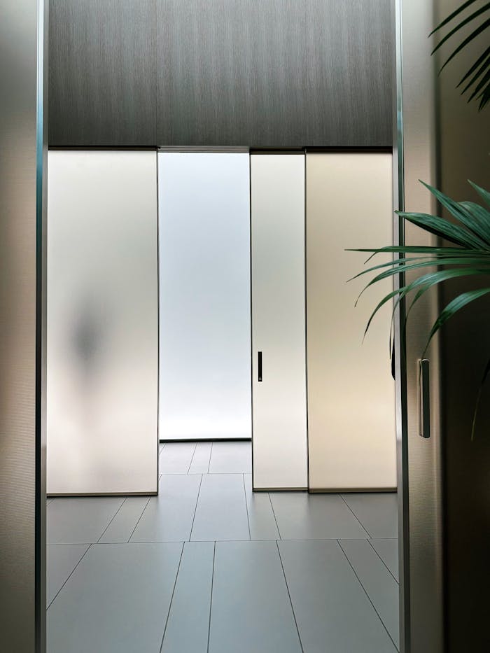 Sleek interior design with frosted glass sliding doors and ambient lighting